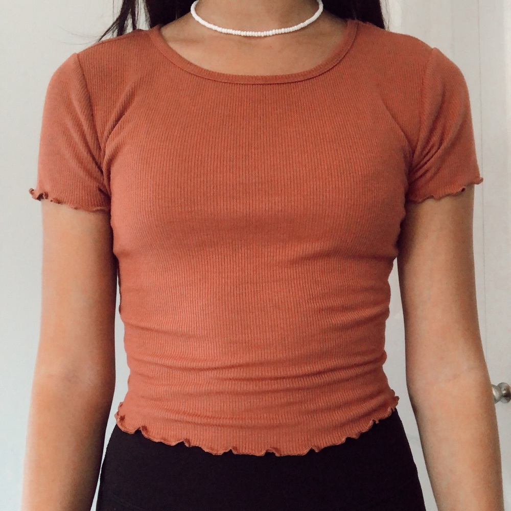 orange ribbed shirt